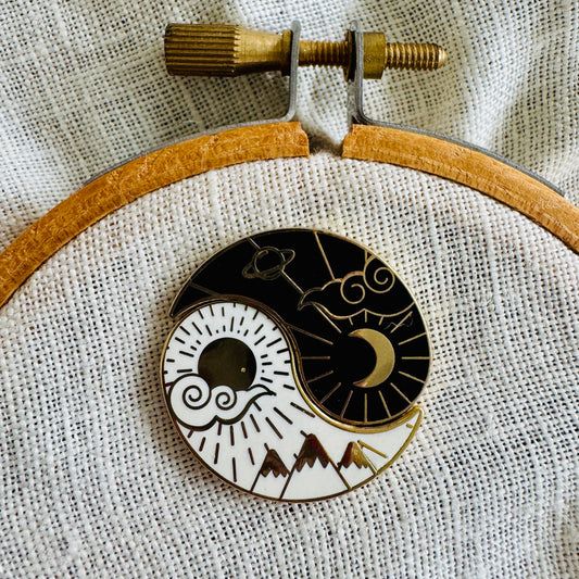 Night and Day Needle Minder Set on an embroidery hoop, sun and moon halves joined