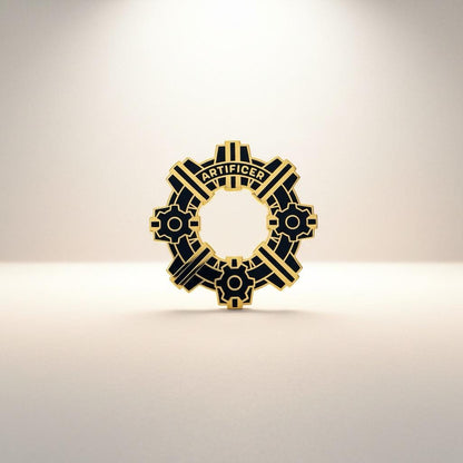 Artificer Gear pin — ornate black and gold gear stamped with the word Artificer, on a cream background