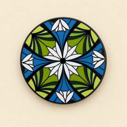 Round elven enamel pin, white flowers on deep green and blue, with black nickel plating