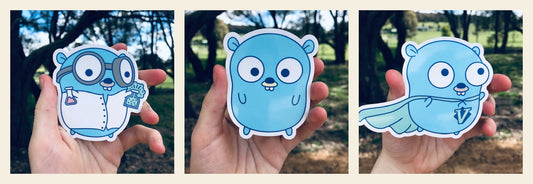 Glossy Gopher Sticker Pack — Functor, Regular, and Vim Go gopher designs side by side on cream background