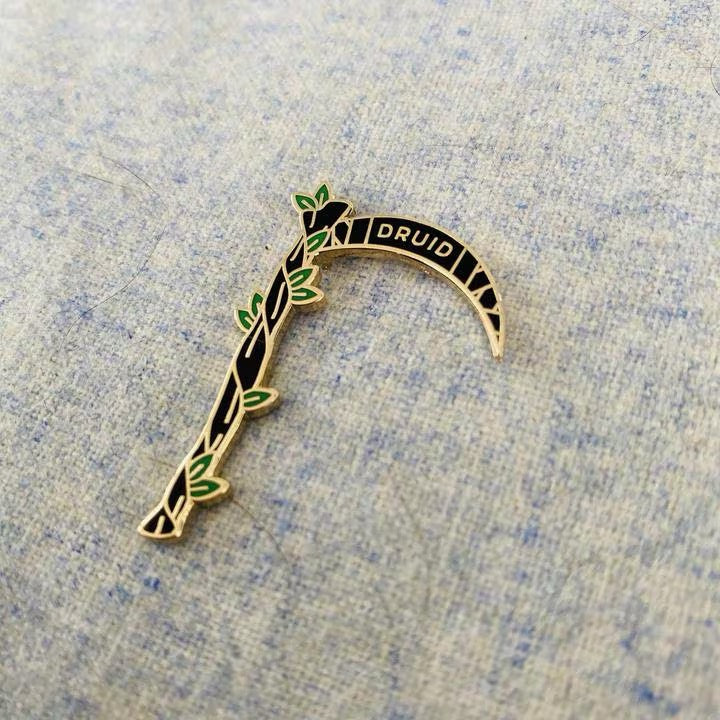 Druid Scythe enamel pin, gold plating variant