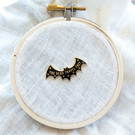 The Dead Travel Fast Needle Minder on white fabric in a hoop