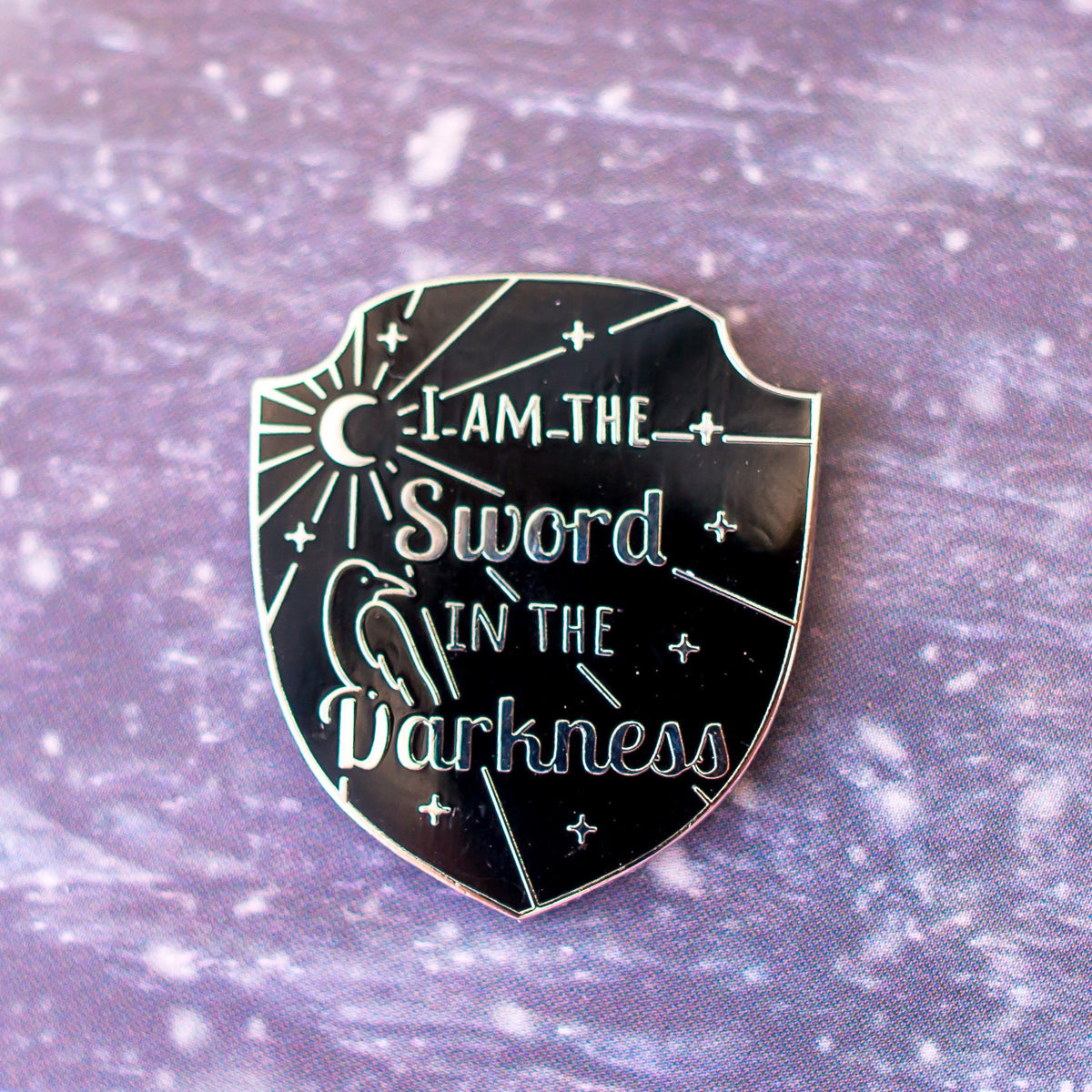 Winter Watch Needle Minder, black shield needle minder reading I am the sword in the darkness