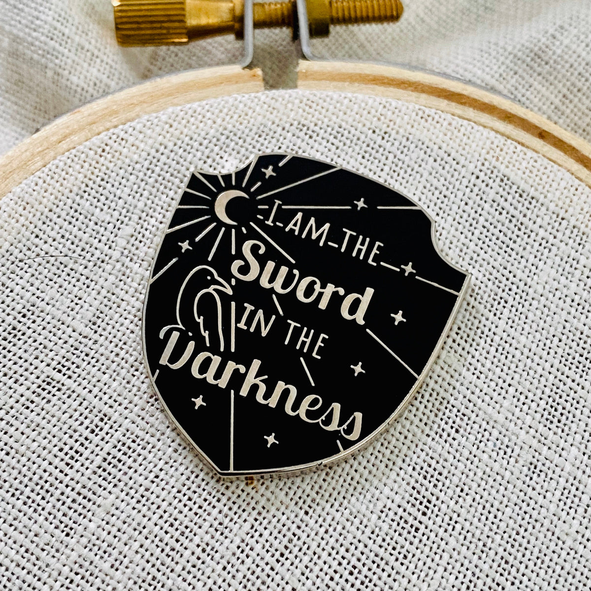 Winter Watch Needle Minder, black shield needle minder reading I am the sword in the darkness