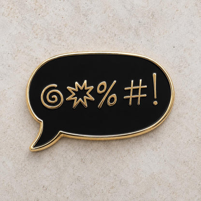 Black sweary enamel pin, gold swear-symbol speech bubble, original design by The Grumpy Unicorn