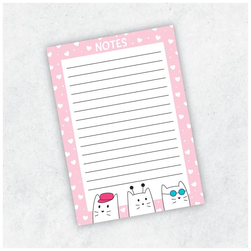 Cat Notepad A6, pink lined notepad with cats along the bottom