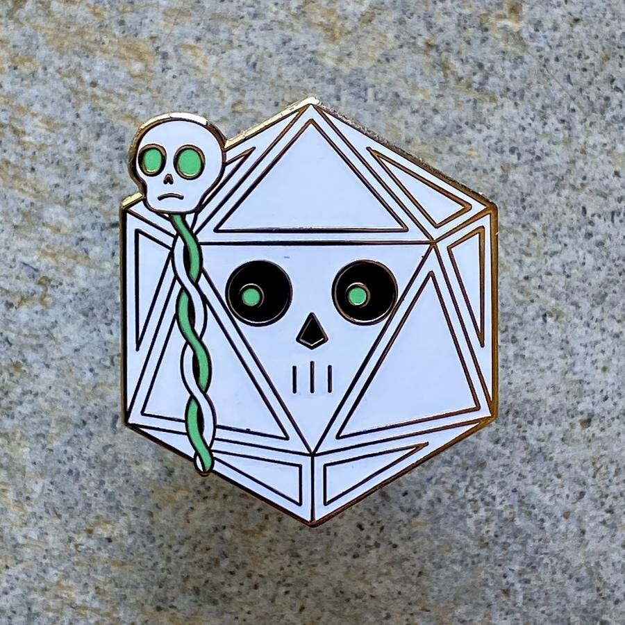 Lich D20 dice creature enamel pin, white d20 with a skull staff
