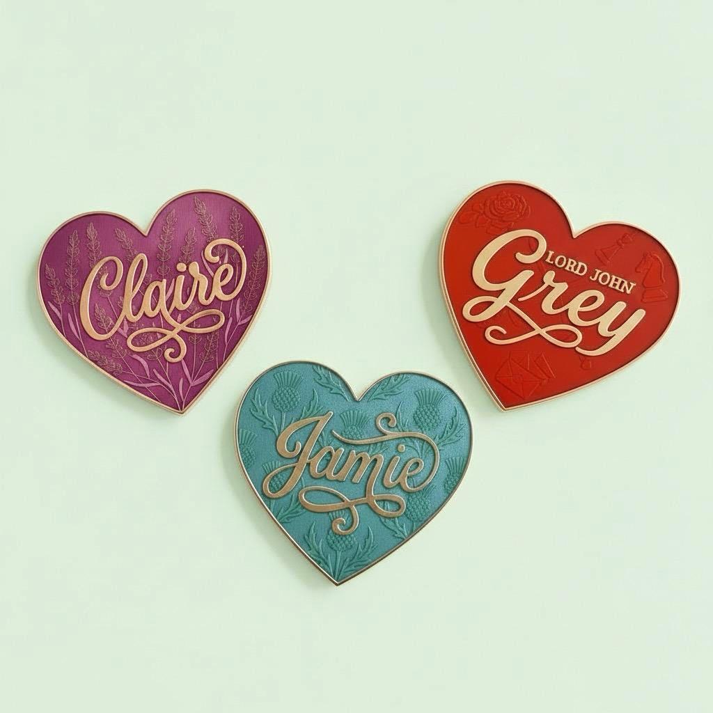 Outlander Heart Pins set — three enamel heart pins (Claire in purple with lavender, Jamie in teal with thistles, Lord John Grey in red with rose, chess pieces and letter) on a soft sage background. 3-pin pack.